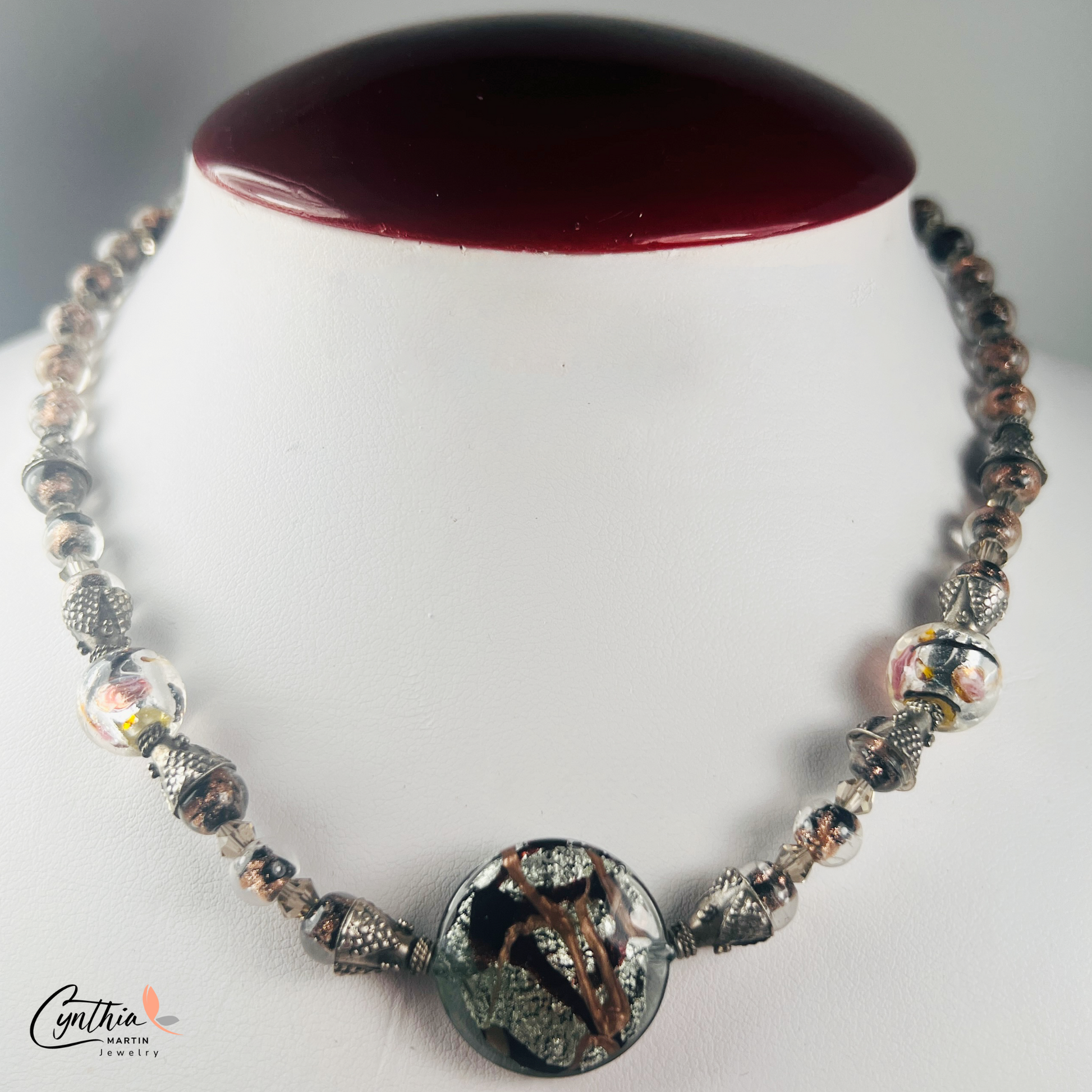 Necklace featuring exquisite Murano blown glass focal beads surrounded by intricate copper-swirled lampwork beads, 15 inches with a 2-inch extender.