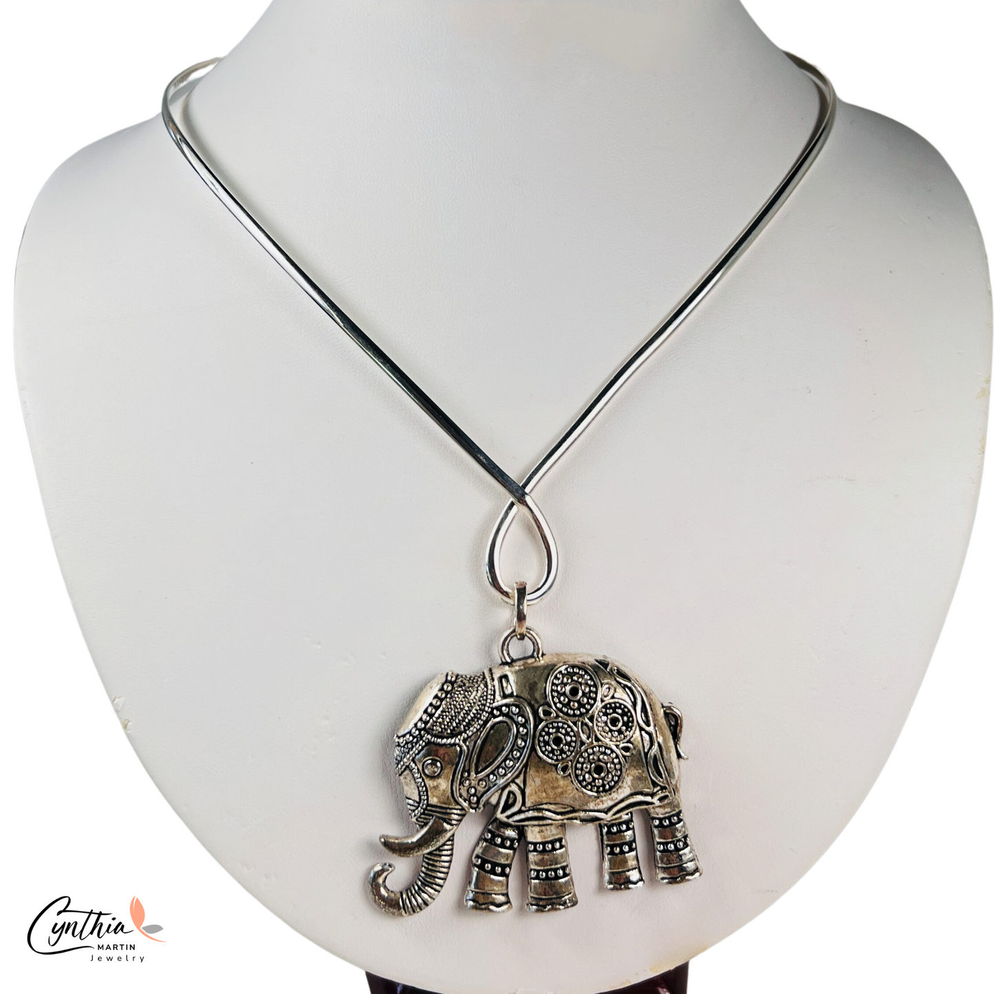 Elegant sterling silver elephant necklace with traditional Indian markings, symbolizing strength and determination.