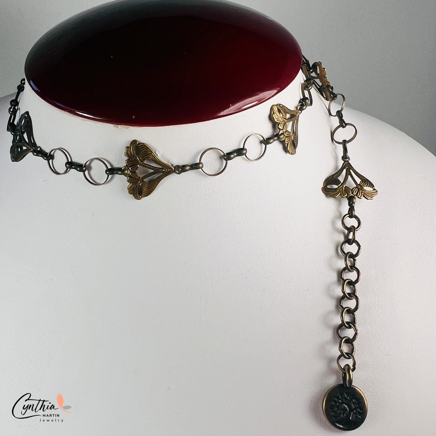 Delicate Art Nouveau-inspired sun-kissed garden flower bracelet with dainty floral designs and a bronze bonsai tree charm.