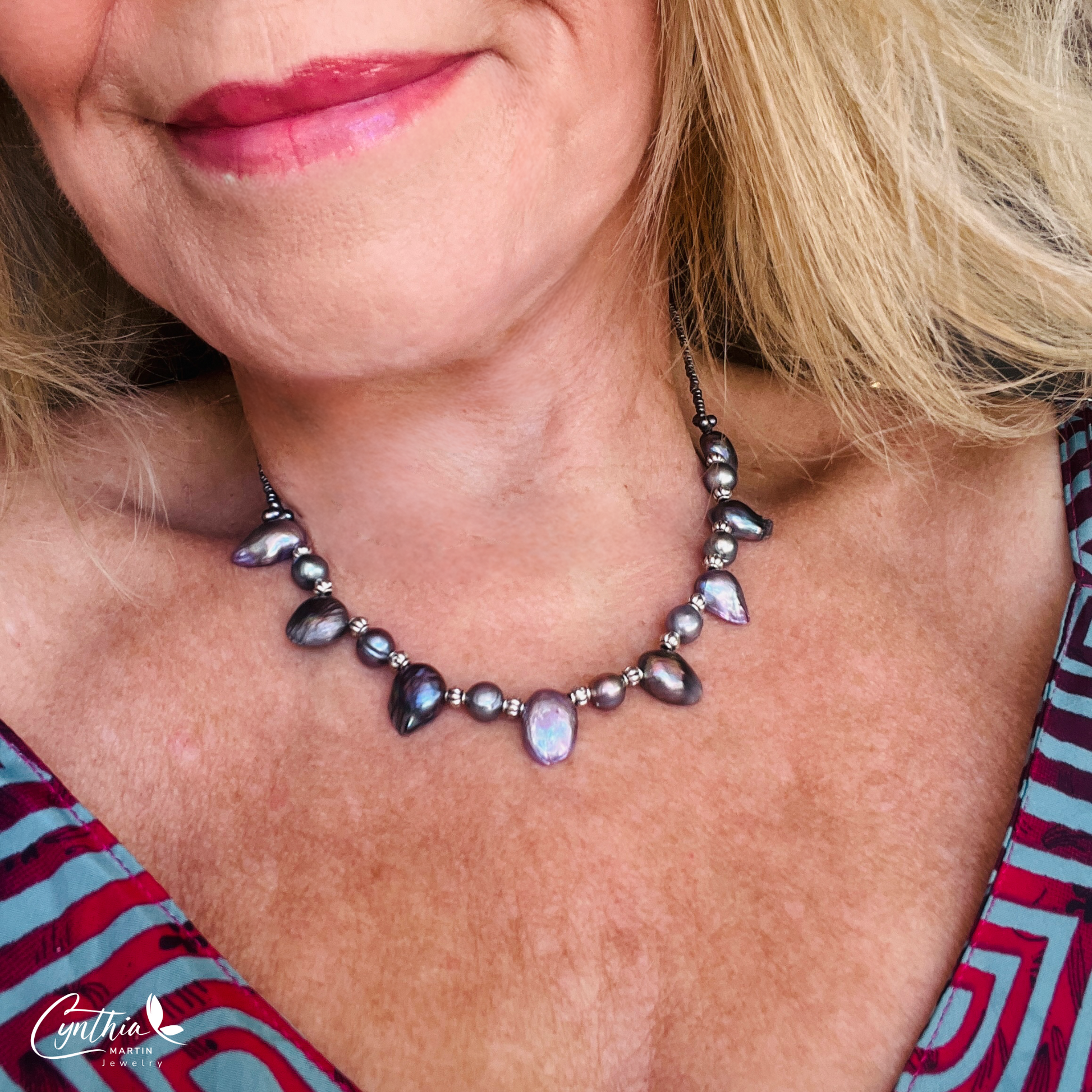 Necklace featuring exclusive dark plum freshwater pearls with silver Bali bead spacers, measuring 15 inches with a 2-inch extender.