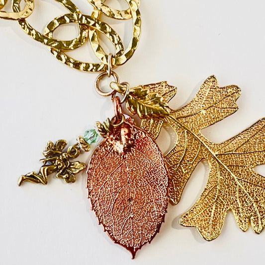 Stylish large looped hammered chain featuring copper and gold-dipped leaves, inspired by fairy forest magic
