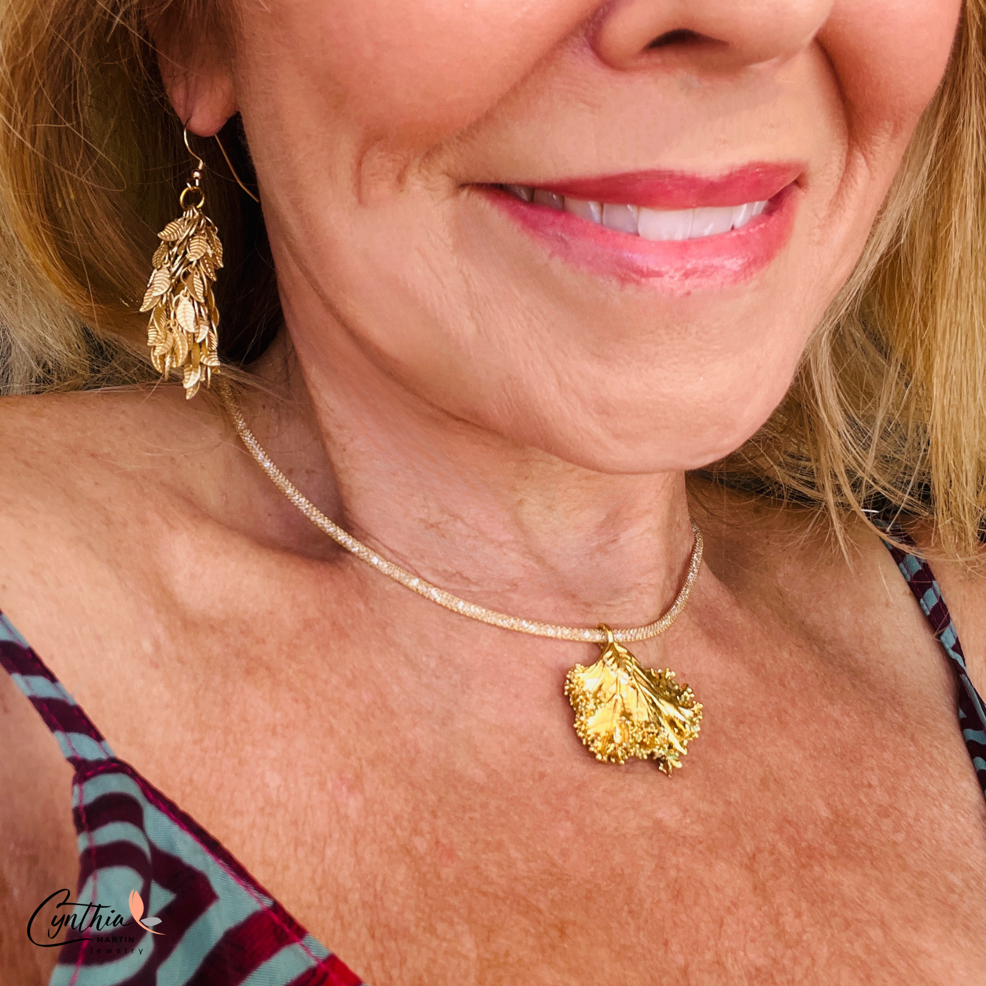 Charming earrings featuring clusters of tiny leaves that sway with movement, creating a delicate statement.