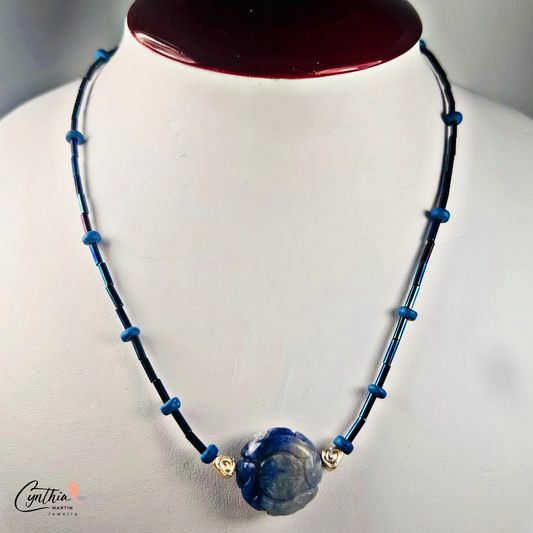 Dainty necklace featuring an Indonesian etched milky dark blue stone focal bead with cobalt blue and ultramarine tube beads, 15 inches with 2-inch extender.