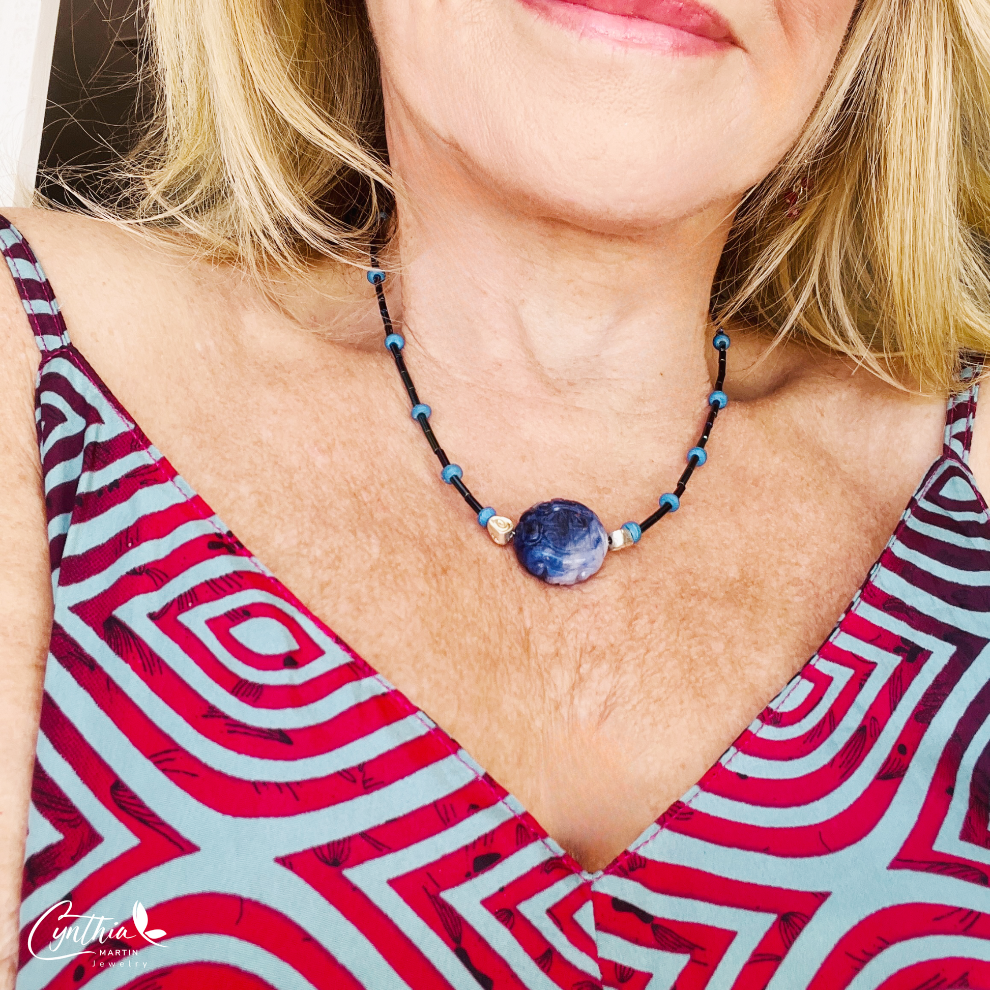 Dainty necklace featuring an Indonesian etched milky dark blue stone focal bead with cobalt blue and ultramarine tube beads, 15 inches with 2-inch extender.