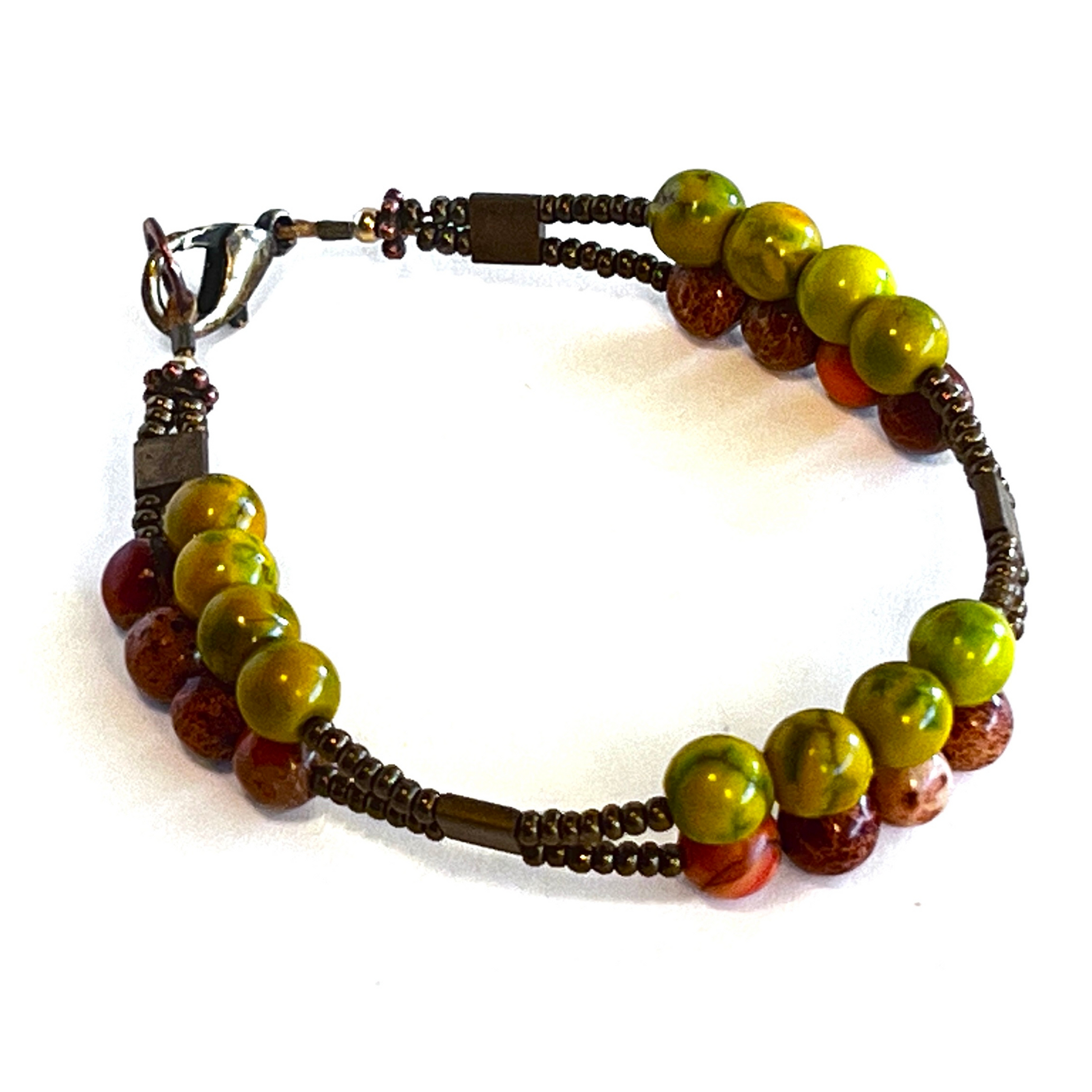 Vibrant double-strand bracelet featuring orange calcite stones and large red bicone beads, secured with a lobster clasp