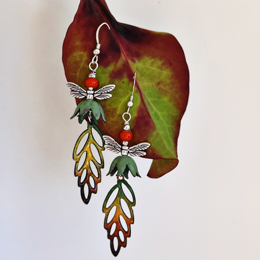 Silver earrings with torch-fired enamel, featuring dragonflies and vibrant autumn colors.
