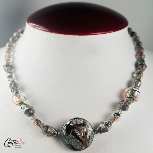 Necklace featuring exquisite Murano blown glass focal beads surrounded by intricate copper-swirled lampwork beads, 15 inches with a 2-inch extender.
