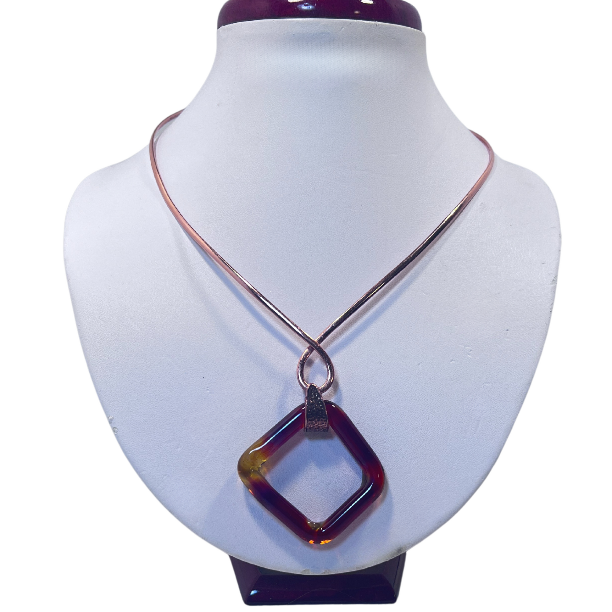 Copper neck collar holding amber square blown glass pendant by Wisconsin artist Tammy Rae, blending artistry with craftsmanship.