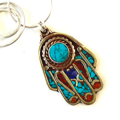 Hand of Fatima good luck charm crafted in silver with turquoise and coral inlays, featuring a multi-ringed chain