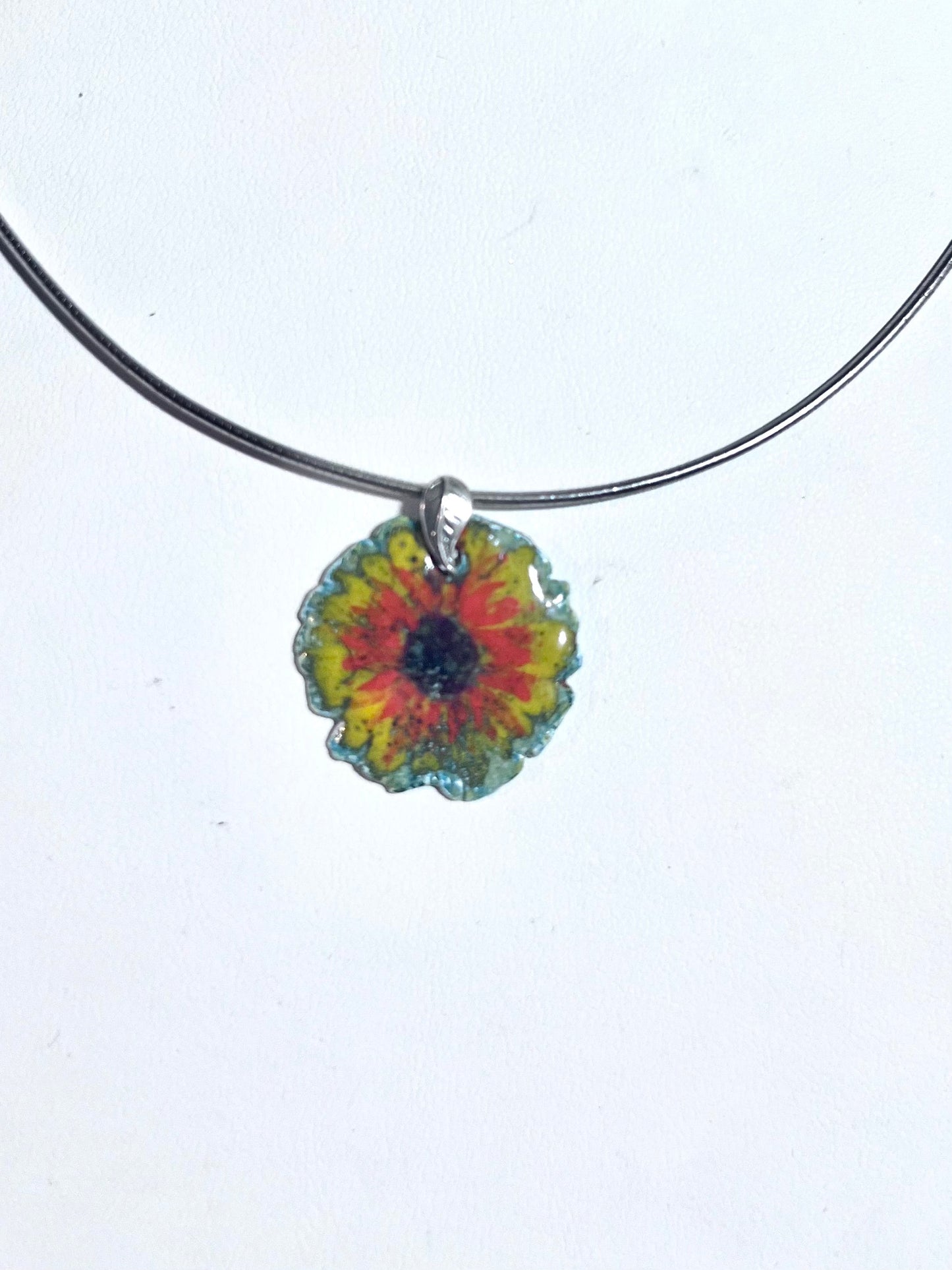 Hand-painted sunflower pendant with vitreous enamel on .999 fine silver, featuring a leaf-shaped sterling silver bail and adjustable omega chain.