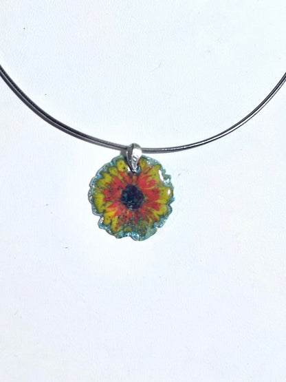 Hand-painted sunflower pendant with vitreous enamel on .999 fine silver, featuring a leaf-shaped sterling silver bail and adjustable omega chain.