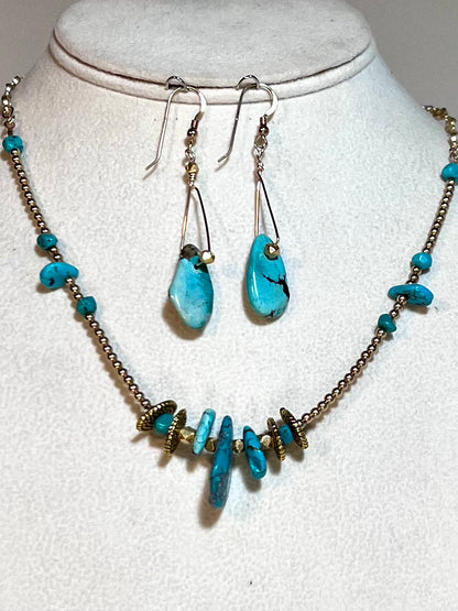 Graduated sizes of authentic turquoise with gold spacers and chains necklace.