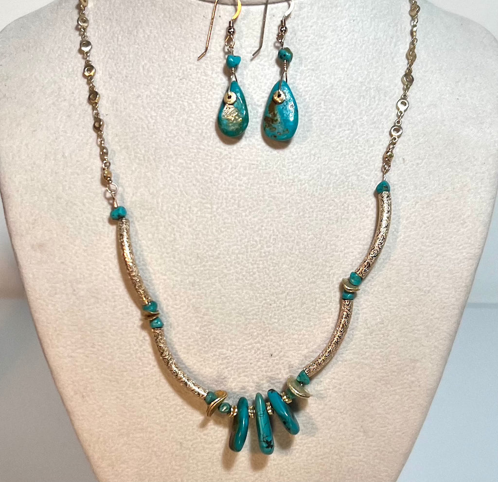 Elegant gold chain necklace with etched gold tubing, adorned with three sliced authentic turquoise pieces.