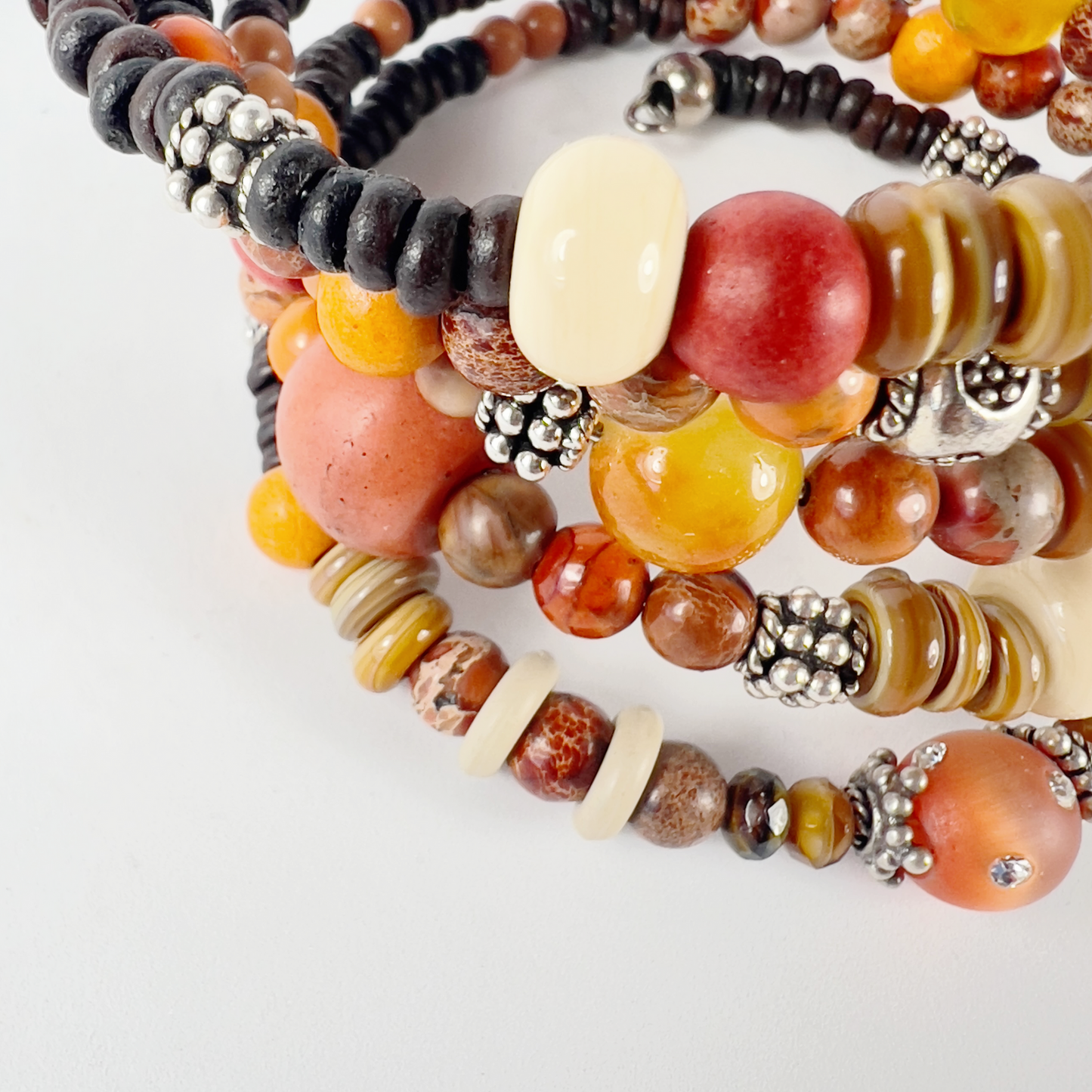 Brown and orange toned 5 wrap-around bracelet with crystaled sienna cat-eye beads, shiny cream rondelles, brown agates, earth tones, dark seed beads, and sterling silver bead caps.