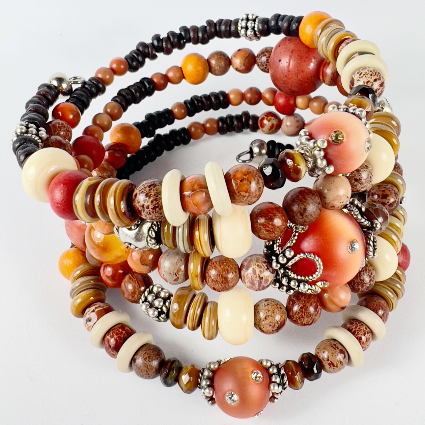 brown and orange toned 5 wrap-around bracelet with crystaled sienna cat-eye beads, shiny cream rondelles, brown agates, earth tones, dark seed beads, and sterling silver bead caps.