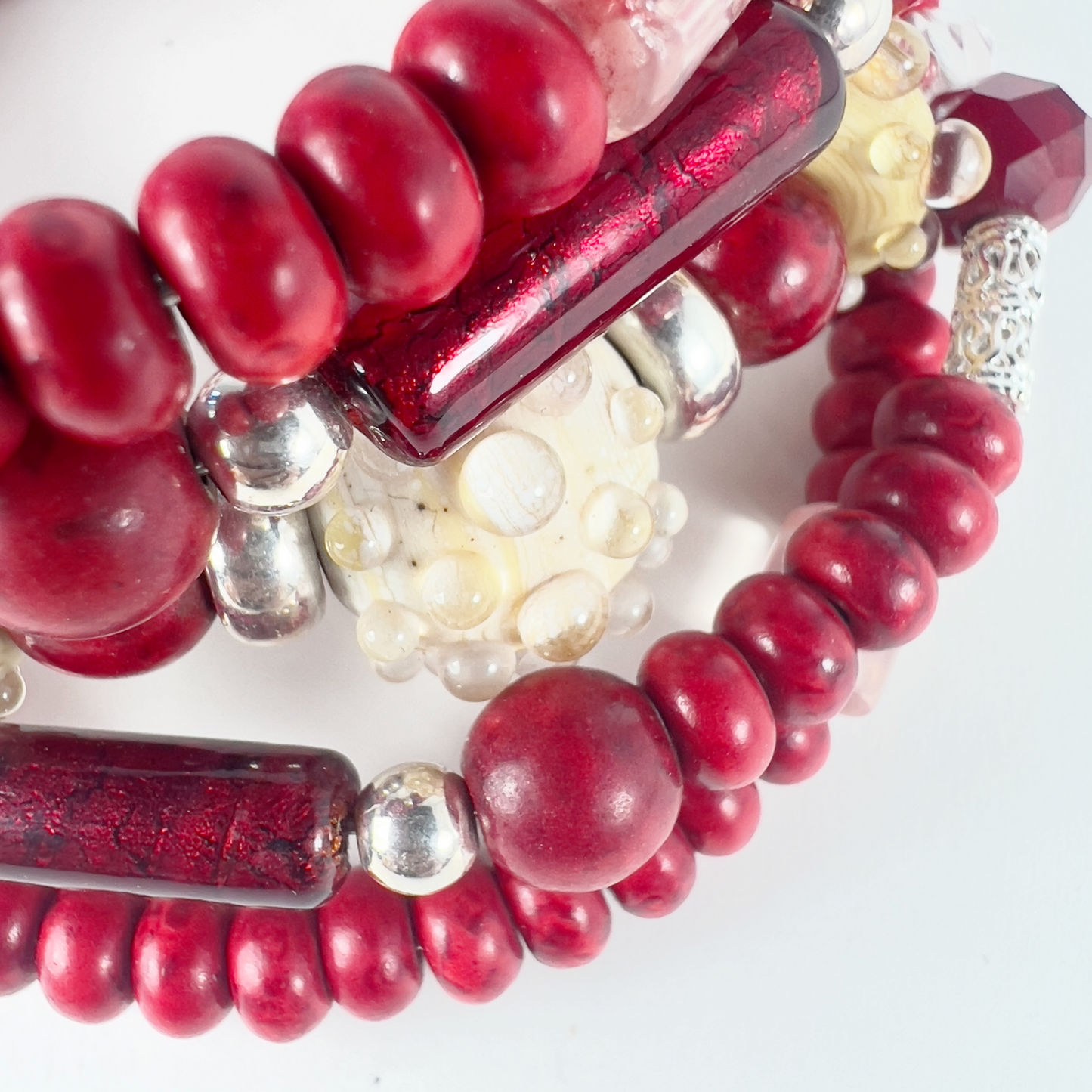 Unique 5-layer wrap bracelet with handmade pottery beads, Venetian Italian tubes, filigree sterling silver spacers, Swarovski crystal beads, and bold red rondelles.