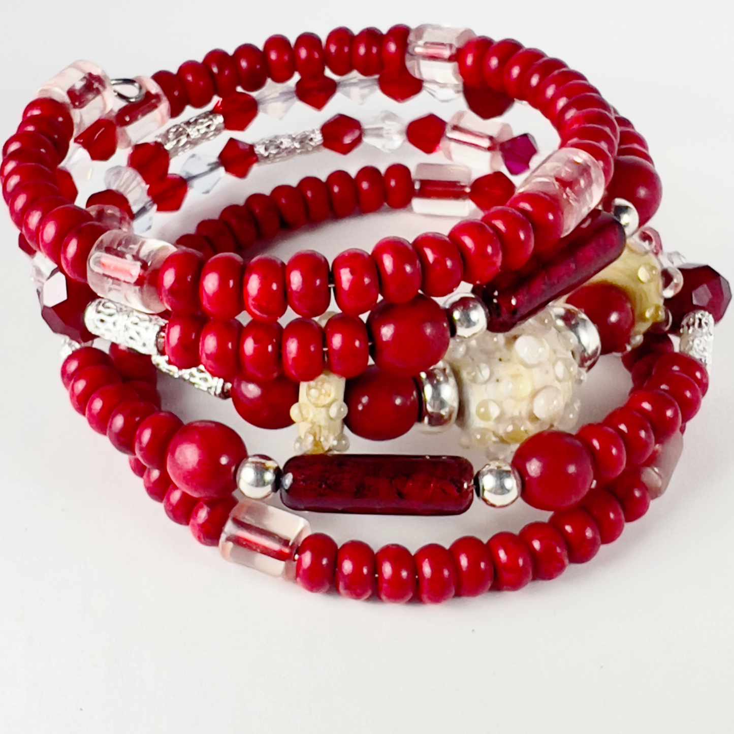 Unique 5-layer wrap bracelet with handmade pottery beads, Venetian Italian tubes, filigree sterling silver spacers, Swarovski crystal beads, and bold red rondelles.