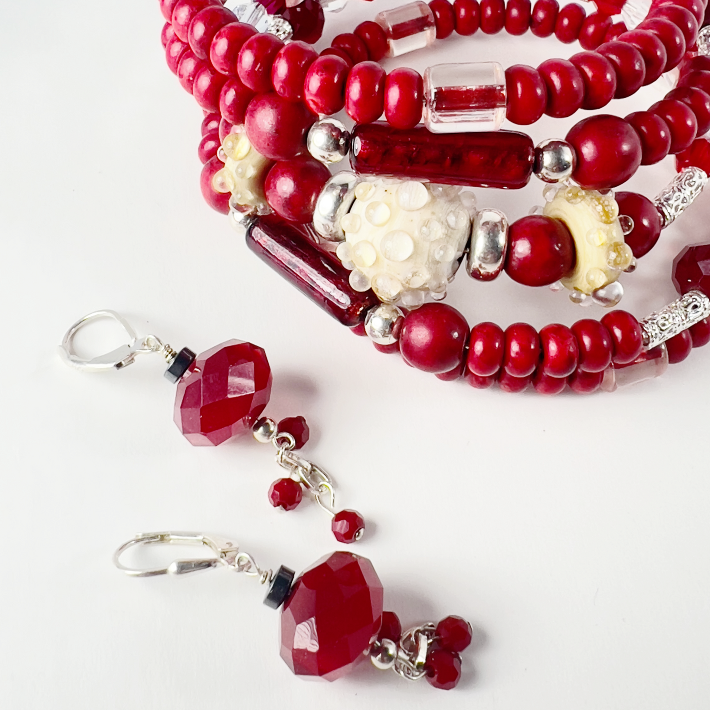 Unique 5-layer wrap bracelet with handmade pottery beads, Venetian Italian tubes, filigree sterling silver spacers, Swarovski crystal beads, and bold red rondelles.