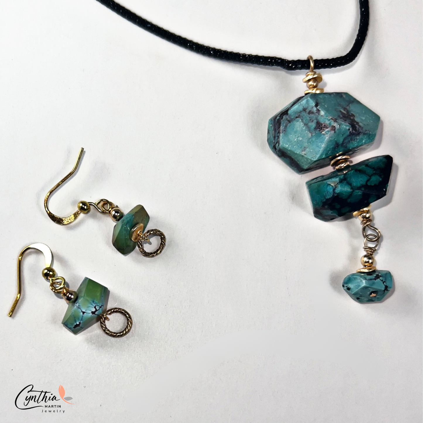 Authentic turquoise nugget pendant with gold chain drop, hanging from a black Italian crystal mesh necklace.