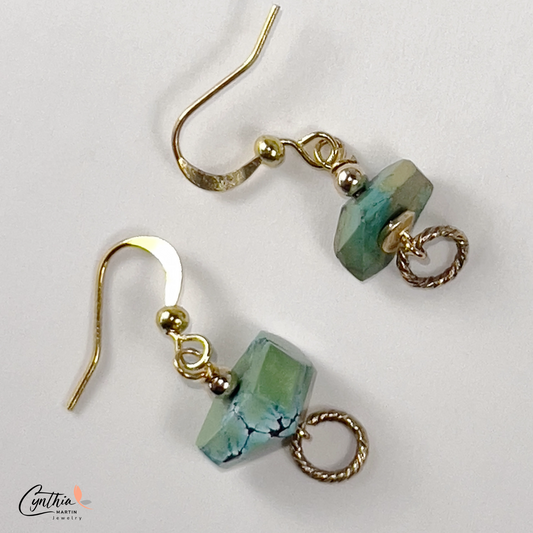 Sliced turquoise nugget earrings with sterling silver ear wires and gold cluster leaf accents.