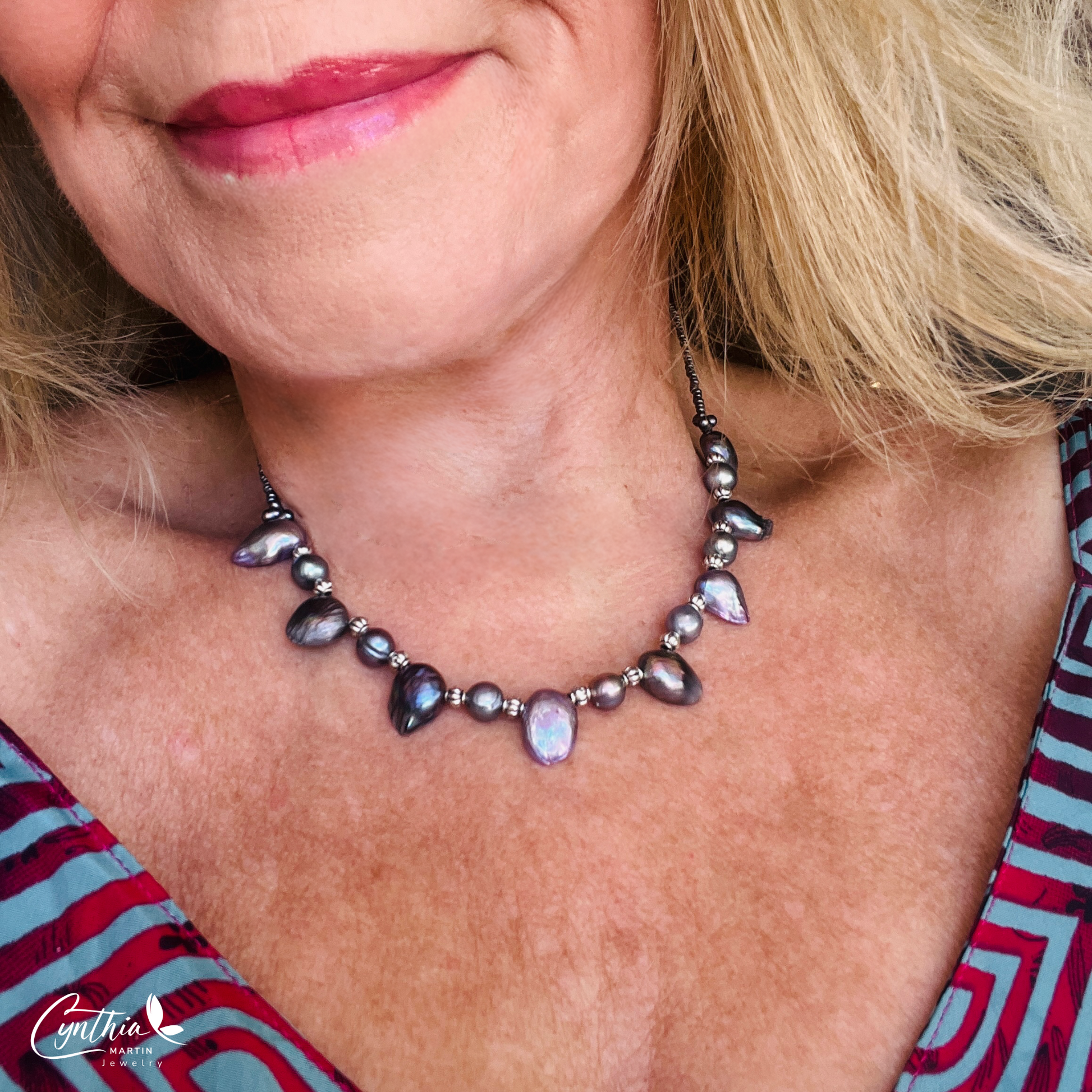 Necklace featuring exclusive dark plum freshwater pearls with silver Bali bead spacers, measuring 15 inches with a 2-inch extender.
