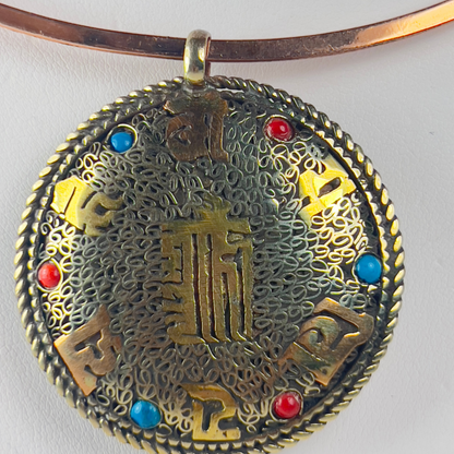 Ancient Chinese medallion pendant on a copper choker necklace.