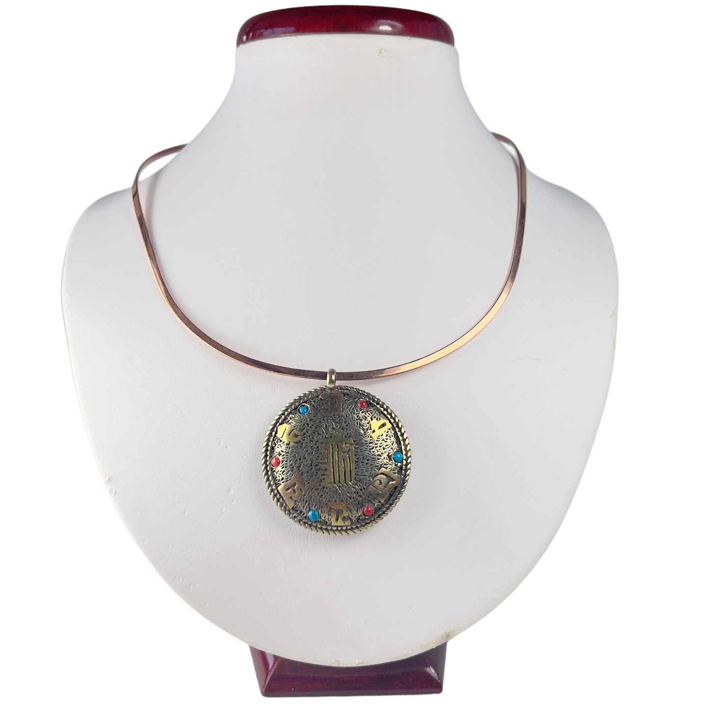 Ancient Chinese medallion pendant on a copper choker necklace.