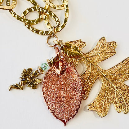 Stylish large looped hammered chain featuring copper and gold-dipped leaves, inspired by fairy forest magic