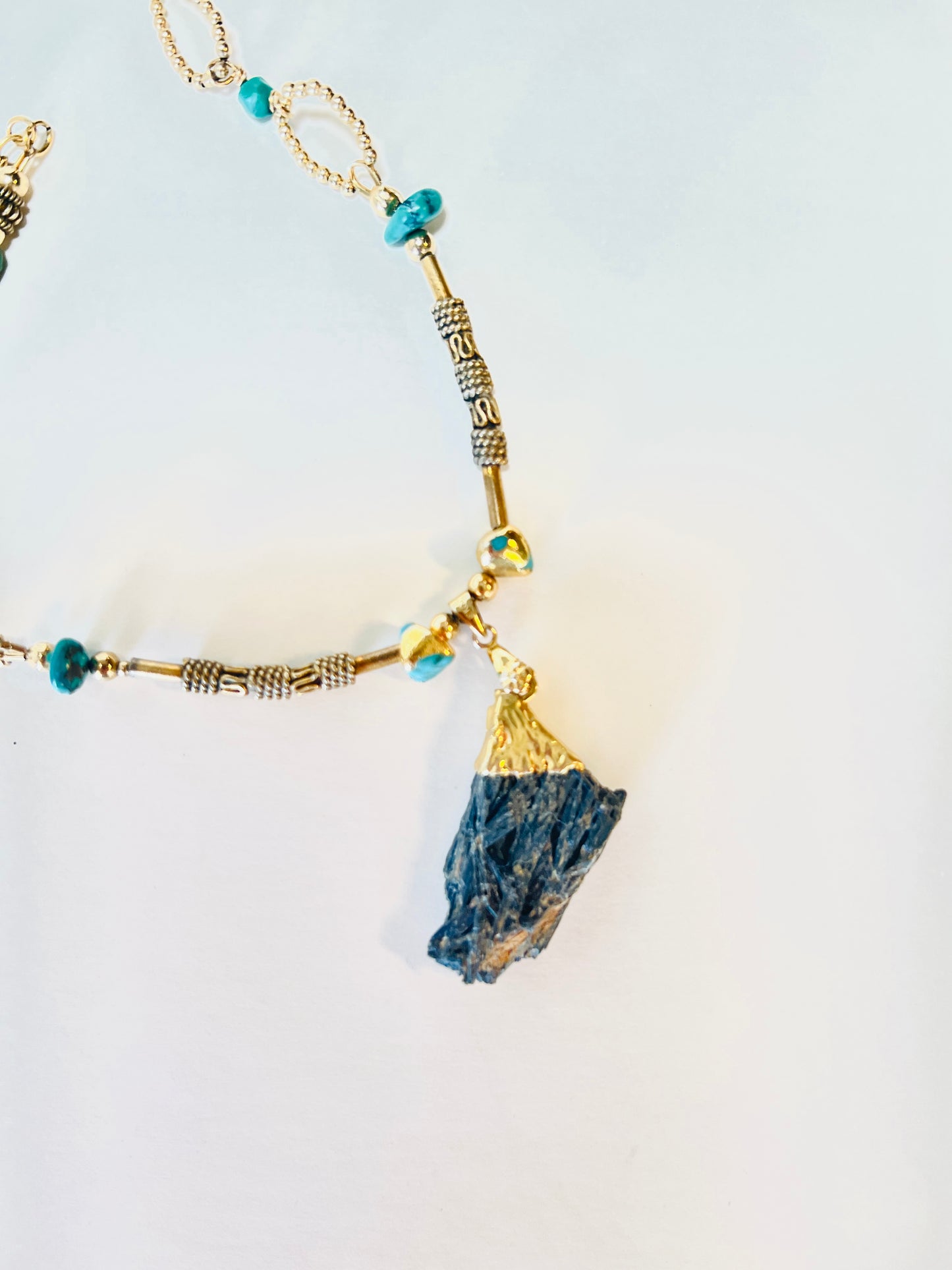 Elegant druzy pendant encased in gold vermeil, adorned with gold beads and turquoise nuggets