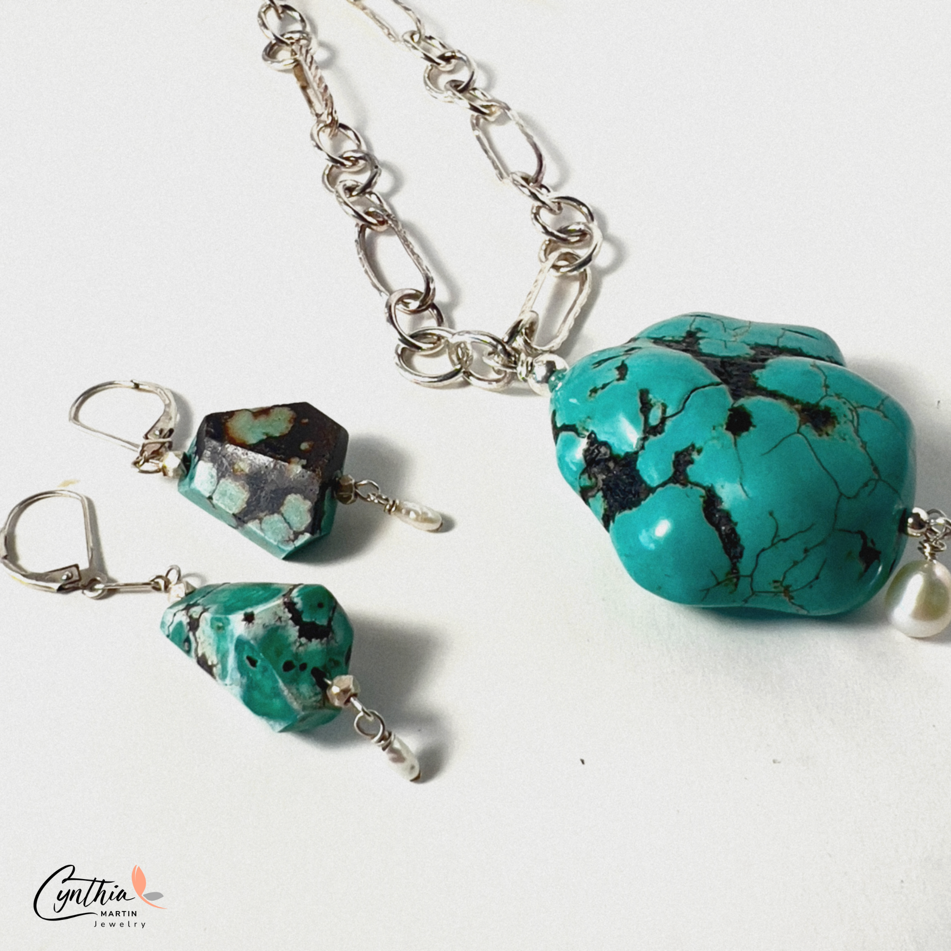 Sliced turquoise nugget earrings with pearl accents and sterling silver French ear wires.