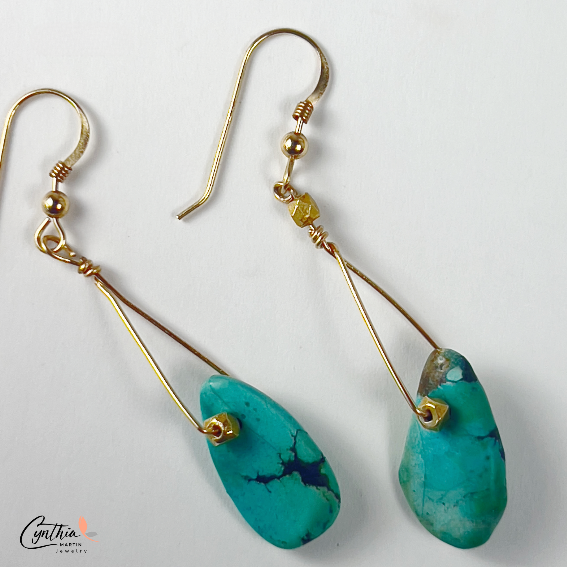 Graduated sizes of authentic turquoise with gold spacers and chains necklace.