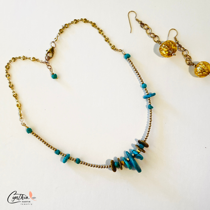 Graduated sizes of authentic turquoise with gold spacers and chains necklace.