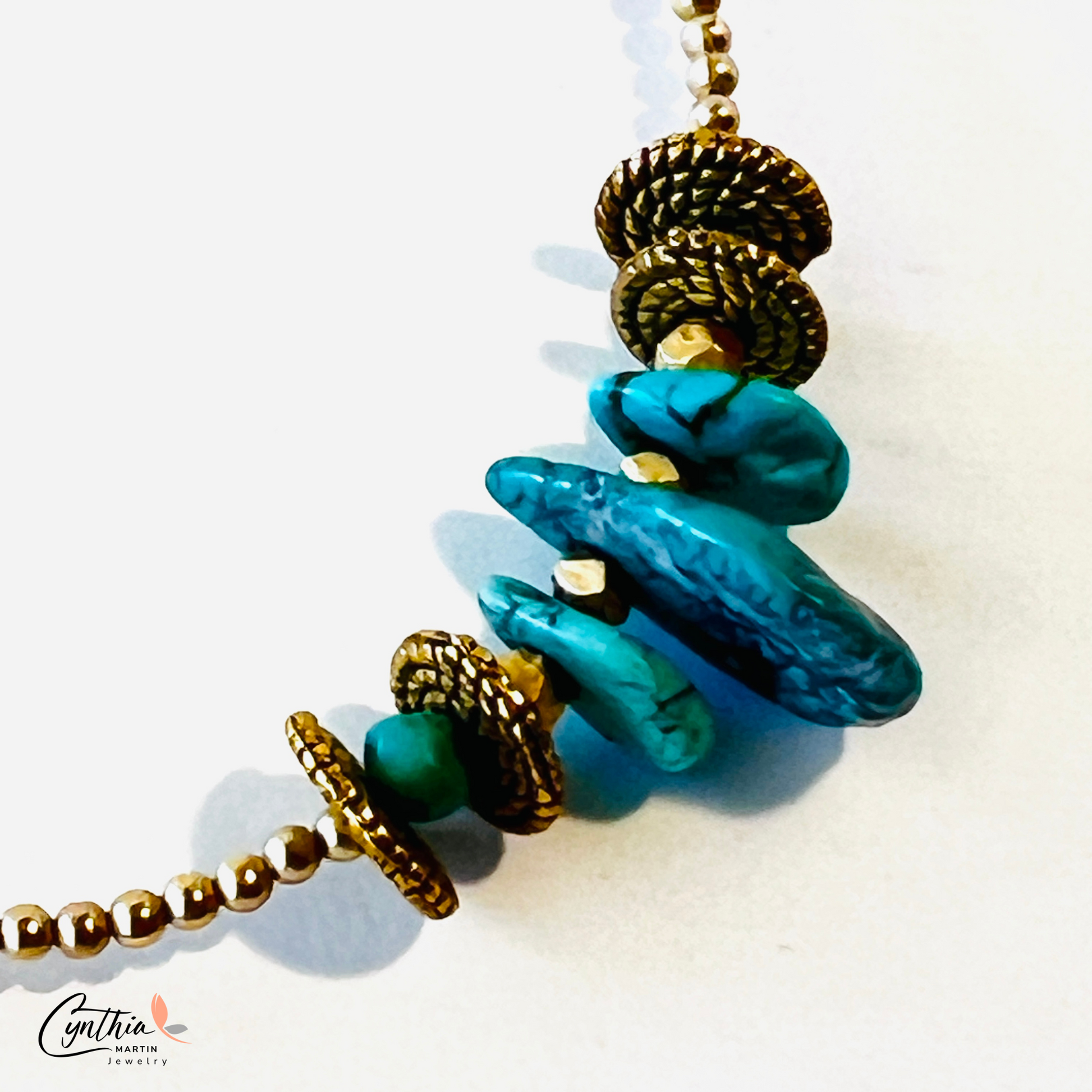 Graduated sizes of authentic turquoise with gold spacers and chains necklace.