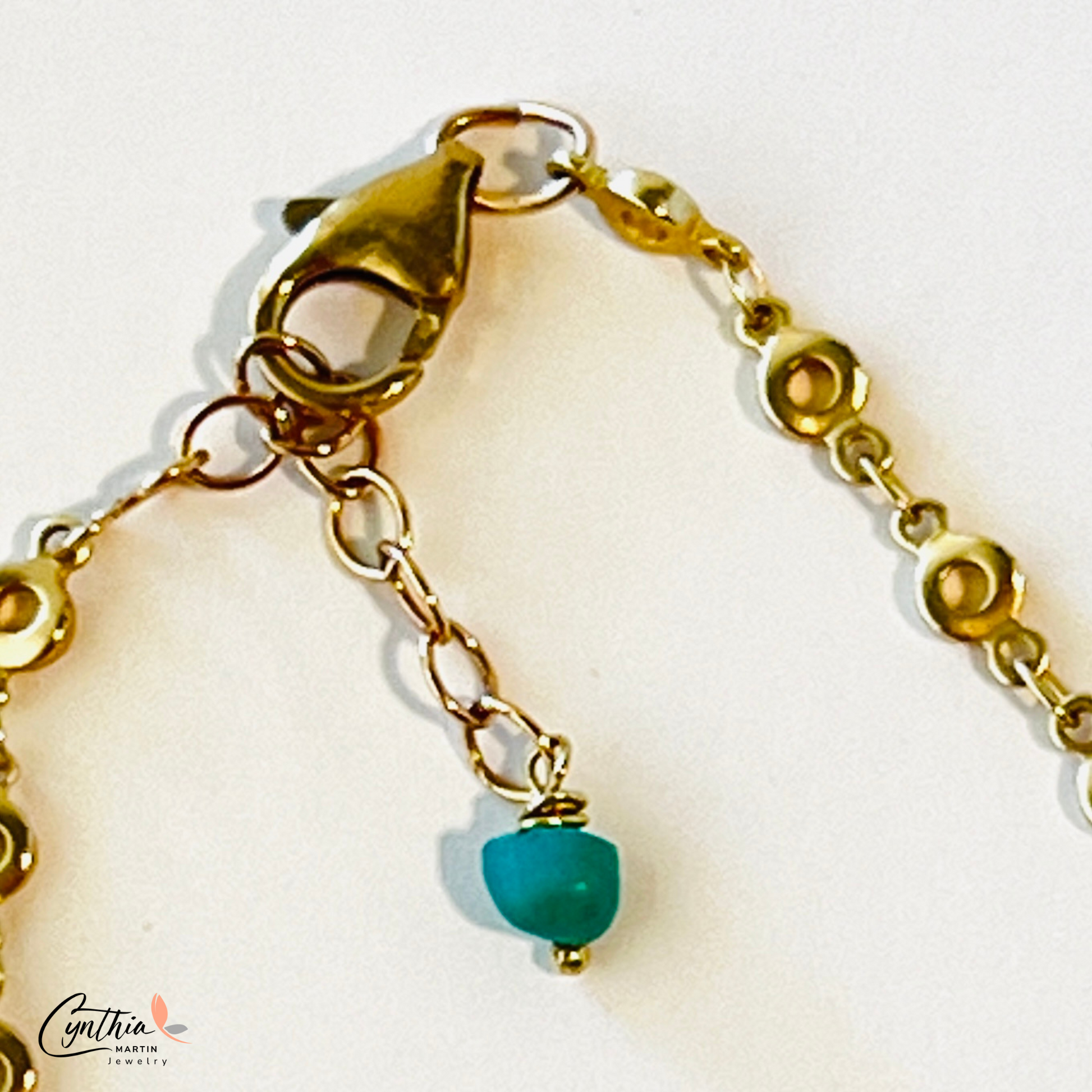 Graduated sizes of authentic turquoise with gold spacers and chains necklace.