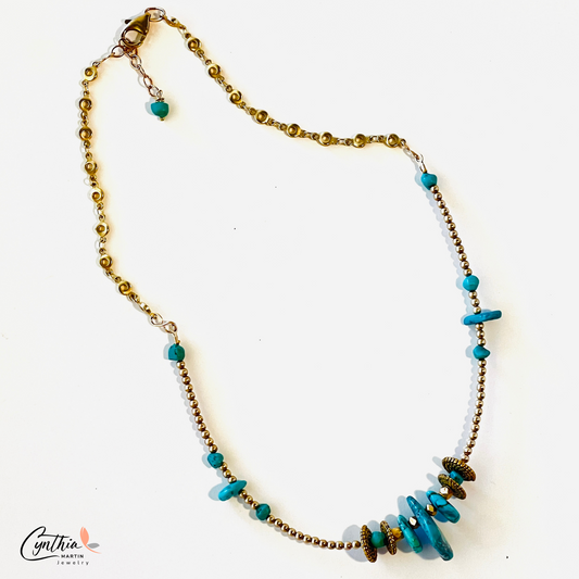 Graduated sizes of authentic turquoise with gold spacers and chains necklace.