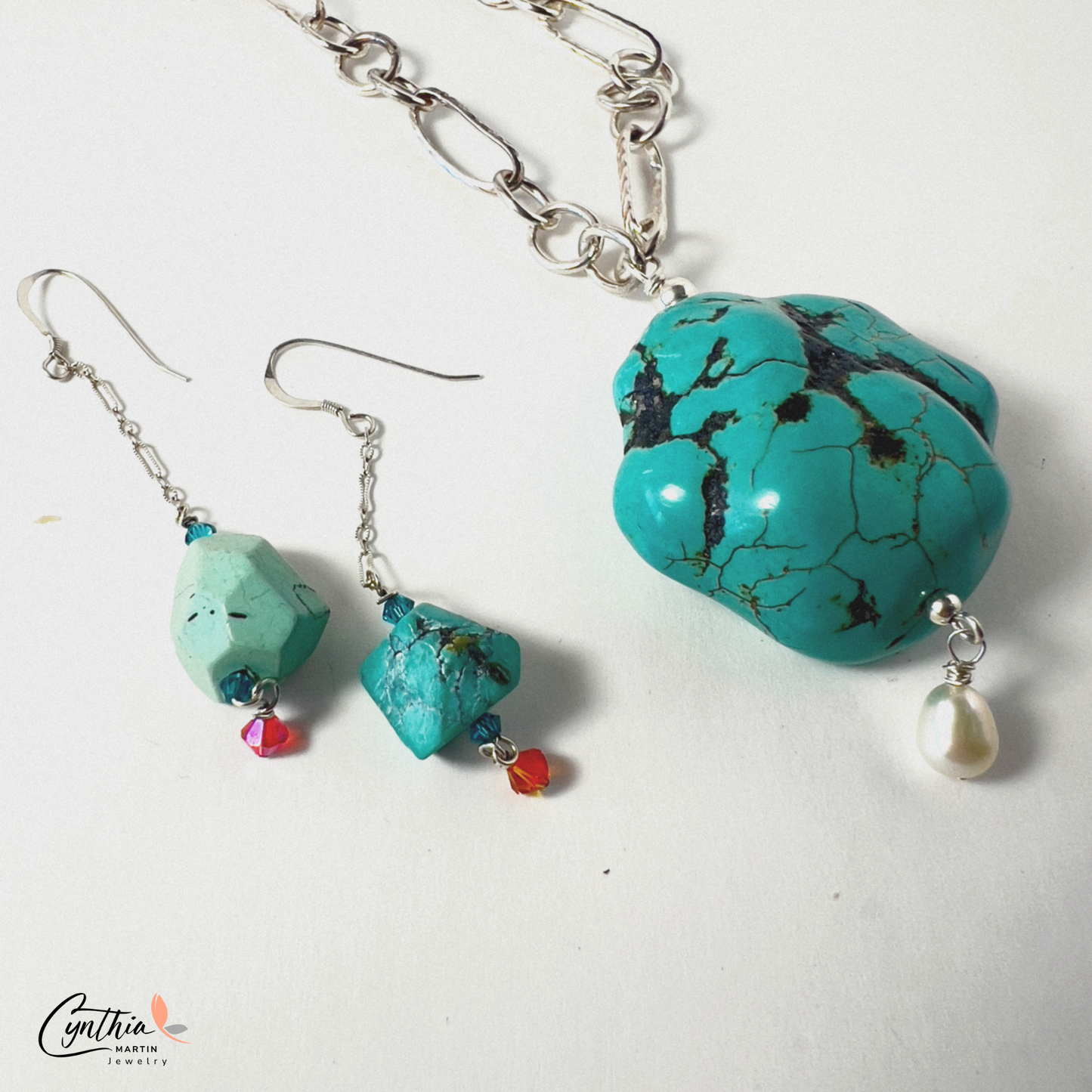 ﻿Earrings with authentic turquoise nuggets on a short .75-inch chain, dangling from sterling silver ear wires.