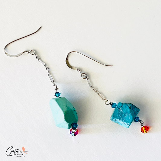 ﻿Earrings with authentic turquoise nuggets on a short .75-inch chain, dangling from sterling silver ear wires.