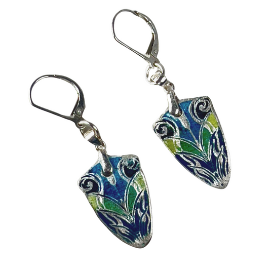 Earrings featuring the champlevé technique with intricate designs filled with vibrant enamel-colored glass powder.