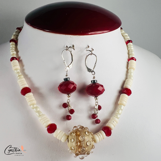 Hand-crafted ceramic bead necklace with glossy white beads, ruby-red rondelles, and white bone heishi beads, 15 inches with 2-inch extender.
