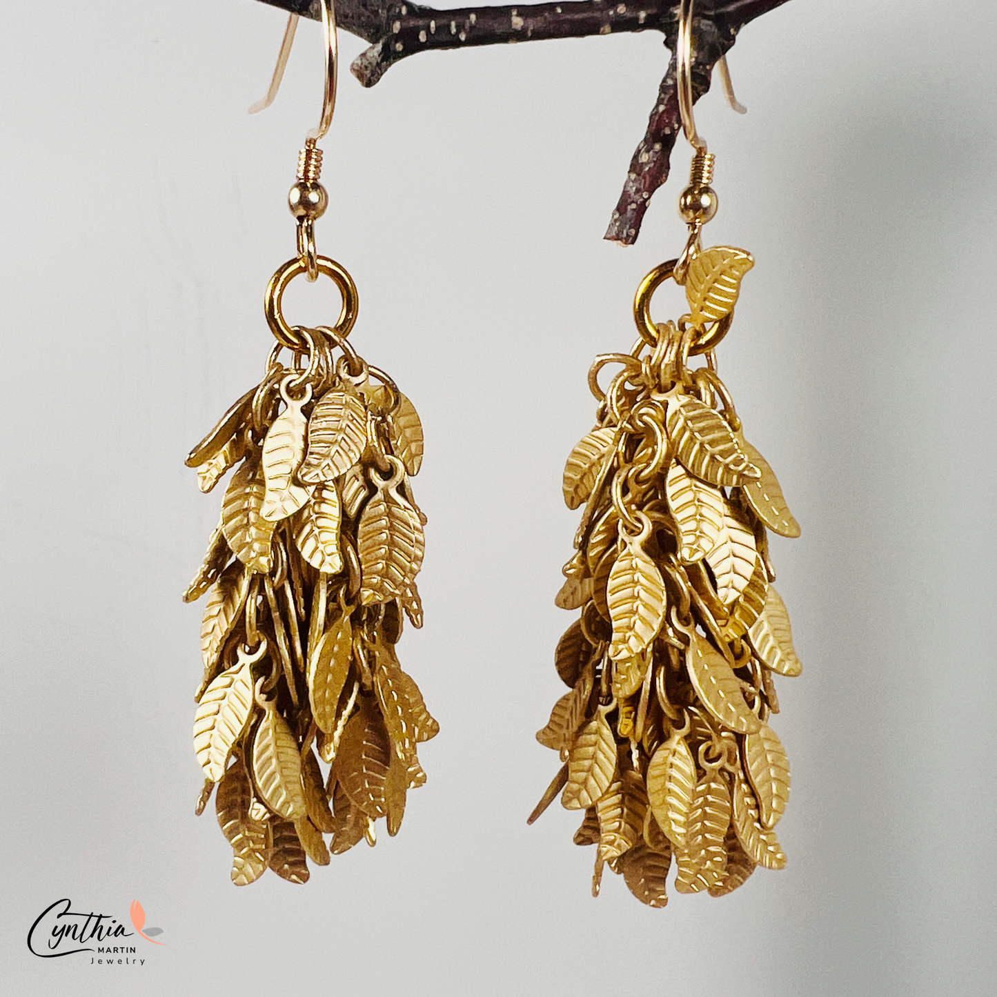 Charming earrings featuring clusters of tiny leaves that sway with movement, creating a delicate statement.
